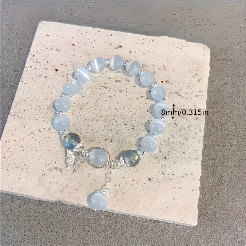 Moderni valkoinen perhoslasihelmirannekoru