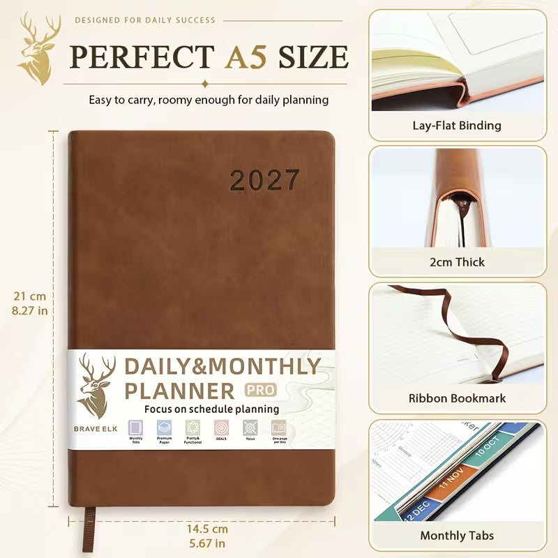 Tuotekuva lilasta A5-kokoisesta Daily & Monthly Planner Pro 2027 -kalenterista, jossa on pehmeä tekonahkakansi, värikkäät kuukausi-indeksit ja lila kirjoituskynä.   