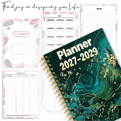 Tuotekuva Planner 2027-2029 -kalenterista, jossa on tummanvihreä fluid art -tyylinen kukkakansi kultahippusilla ja kultainen kierresidonta.   