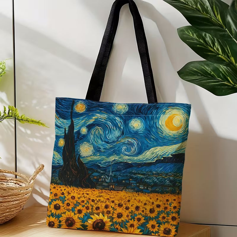 Sinikeltainen Van Gogh -kangaskassi, jossa yhdistyvät Tähtiyö-yötaivas ja auringonkukkapelto.