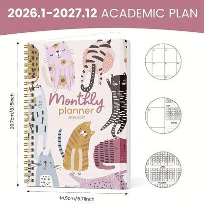 Söpö kissa-aiheinen kuukausikalenteri vuosille 2026-2027, avattuna tammikuun 2026 kohdalta, vierellään erilaisia värikkäitä suunnittelutarroja