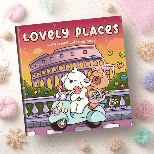 Avattu Lovely Places -värityskirja, jonka sivulla on kotoisa pienen mökin ja puutarhan kuvitus. Sivun vieressä on laadukkaita puuvärikyniä ja pastellisävyisiä tusseja.
