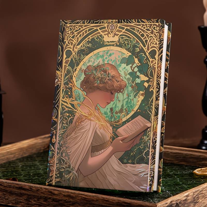Ylellinen A5-kokoinen retro-muistikirja, jonka kannessa on Art Nouveau -tyylinen kuva naisesta lukemassa, koristeltuna kultaisilla kimaltelevilla kuvioilla.
